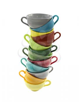 Stack of colorful coffee or tea cups isolated on white background