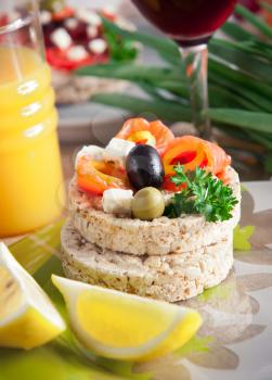 Healthy food, crispbread with cheese, fish and vegetables