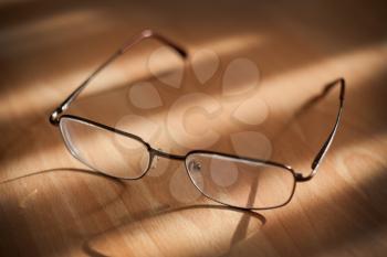 Eyeglasses on warm background, small dof
