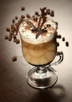 Late coffee with chocolate and coffee grains