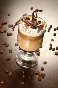 Late coffee with chocolate and coffee grains