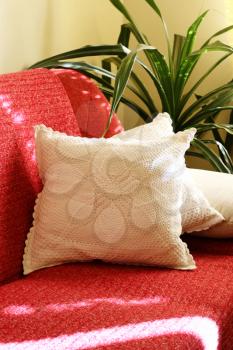 Red couch with white pillows