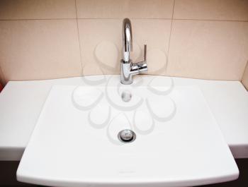 Modern bathroom sink in white ceramic 