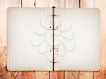Open bank white notebook on Oak wood background 