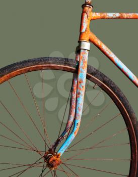 Old rusty bicycle, isolated on green