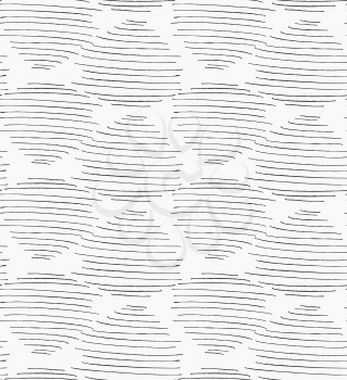 Inked strokes in egg shape on white.Seamless pattern. Fabric design. Simple hand drawn hatched design.