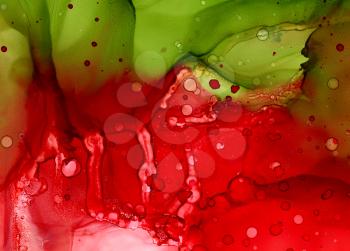 Abstract backdrop red with green flow.Colorful painted background hand drawn with bright inks and watercolor paints. Bright color splashes and splatters create uneven artistic background.