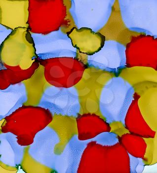 Abstract blue red green stains merging.Colorful background hand drawn with bright inks and watercolor paints. Color splashes and splatters create uneven artistic modern design.