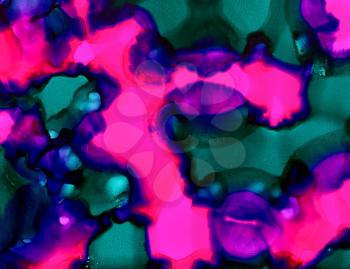 Abstract paint bright pink purple green uneven flow.Colorful background hand drawn with bright inks and watercolor paints. Color splashes and splatters create uneven artistic modern design.