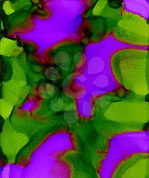 Abstract paint purple green spots merging.Colorful background hand drawn with bright inks and watercolor paints. Color splashes and splatters create uneven artistic modern design.