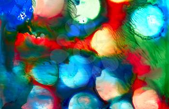 Abstract painted blue smudged spots with some red green.Colorful background hand drawn with bright inks and watercolor paints. Color splashes and splatters create uneven artistic modern design.