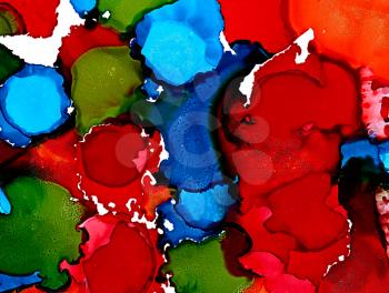 Abstract red green blues merging spots.Colorful background hand drawn with bright inks and watercolor paints. Color splashes and splatters create uneven artistic modern design.