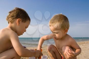 Two young children on the beach