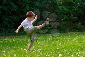 A young child playing in the nature