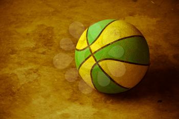 Vintage picture of a basketball on cement floor