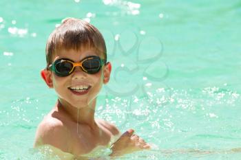 Young child swimming in the pool