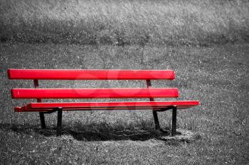 Empty red bench in park