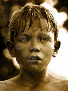 Vintage portrait of a child with water drop on face