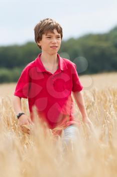 young child in a wheat field