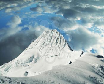 Royalty Free Photo of a Alpamayo Mountain Peak in the Cordilleras