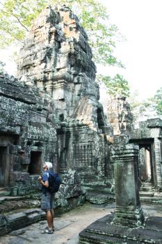 Royalty Free Photo of a Tourist in Angkor City in Cambodia