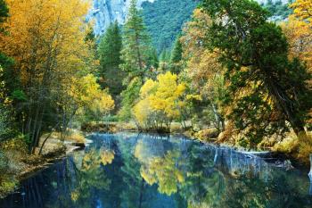 Royalty Free Photo of a River and Forest in Autumn