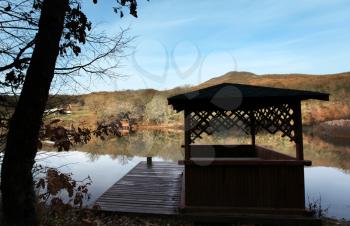 Royalty Free Photo of a Lake and Dock in Autumn