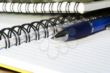 Royalty Free Photo of a Spiral Notebook and Pen