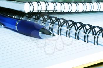 Royalty Free Photo of a Spiral Notebook and Pen
