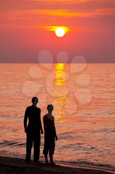 Royalty Free Photo of Silhouettes of Boys on the Beach