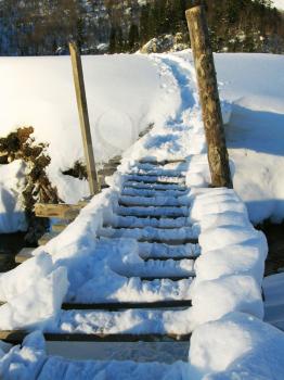 Royalty Free Photo of a Snow Covered Walking Bridge