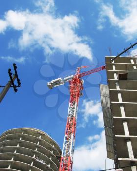 Royalty Free Photo of a Crane Over a Building