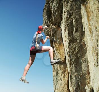 Royalty Free Photo of a Female Rock Climber