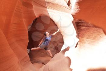 Royalty Free Photo of a Woman Climbing in a Canyon
