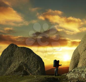 Royalty Free Photo of a Backpacker at Sunset