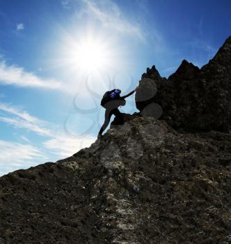 Royalty Free Photo of a Person Rock Climbing