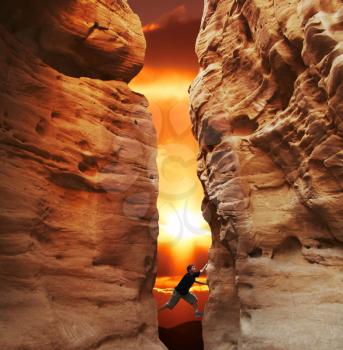 Royalty Free Photo of a Person Climbing in a Canyon