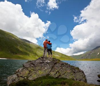 Royalty Free Photo of a Couple Standing at a Lake