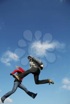 Royalty Free Photo of Two People Jumping