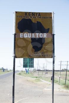 Royalty Free Photo of a Sign at the Equator in Kenya