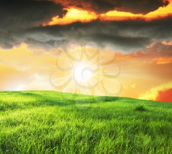 Royalty Free Photo of a Field and Sun
