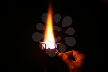 Royalty Free Photo of a Match Lighting a Burner