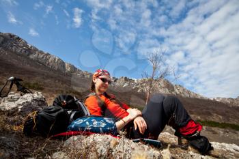 Royalty Free Photo of a Woman Resting While Hiking