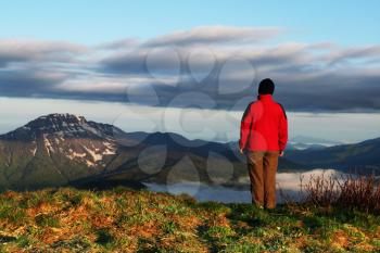 Royalty Free Photo of a Woman Overlooking a Mountain