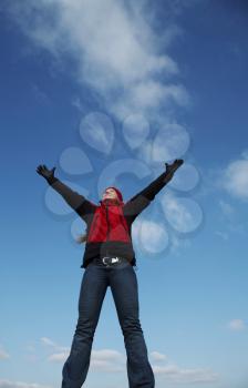Royalty Free Photo of a Happy Woman with Arms Outstretched