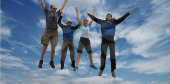 Royalty Free Photo of Four People Jumping