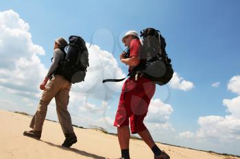 Royalty Free Photo of Two Men Walking in the Desert