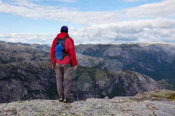 Royalty Free Photo of a Hiker in the Mountains in Norway