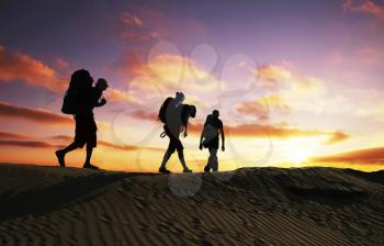 Royalty Free Photo of Backpackers at Sunset in the Desert