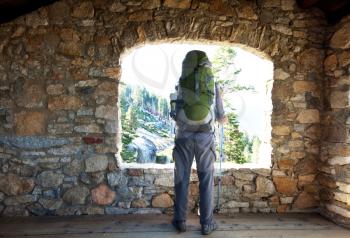 Royalty Free Photo of a Backpacker in a Stone Building